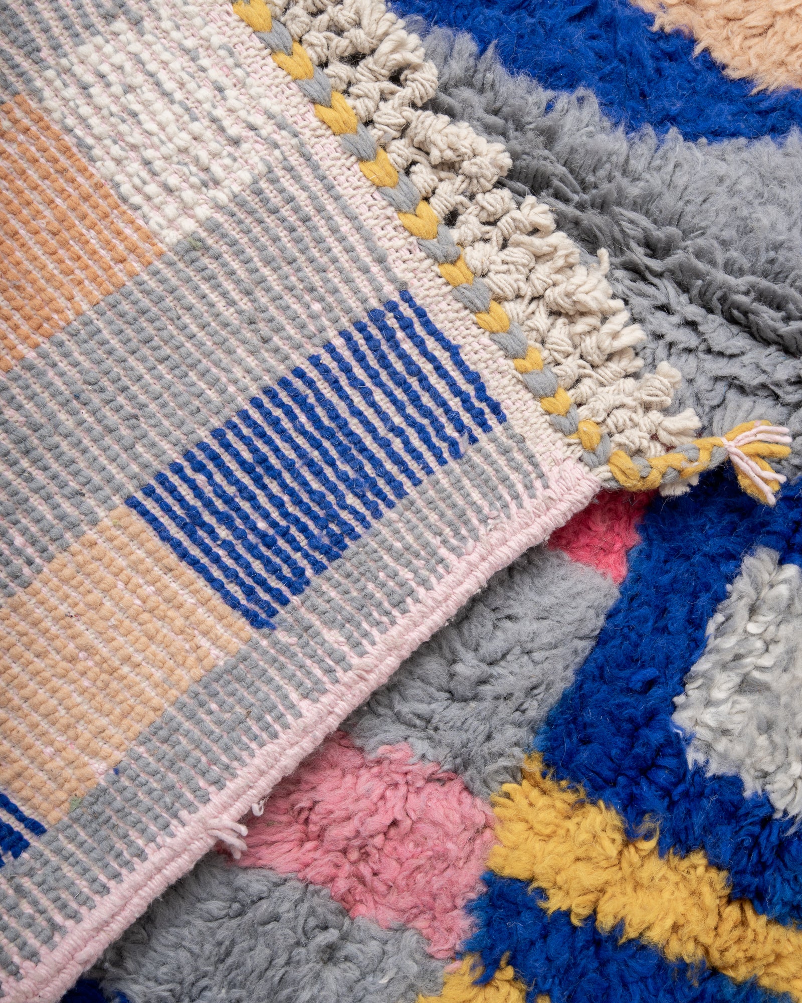 Modern, designer, handcrafted Berber rug from Morocco. Beniourain carpet with beautiful colours and patterns and fluffy wool texture.